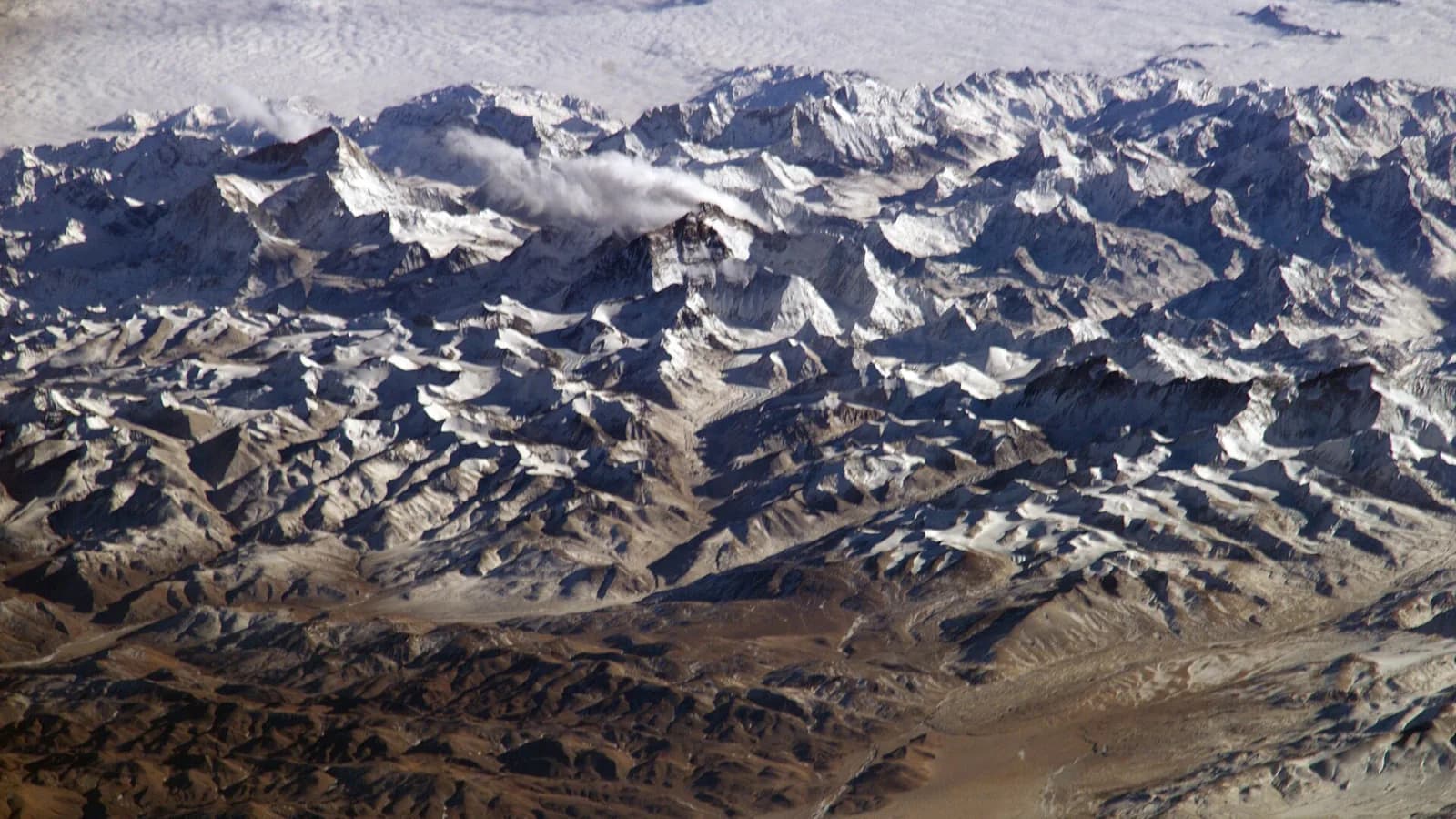 Snow-capped Himalayan peaks rising above the Khumbu region of Nepal, the homeland of Apa Sherpa