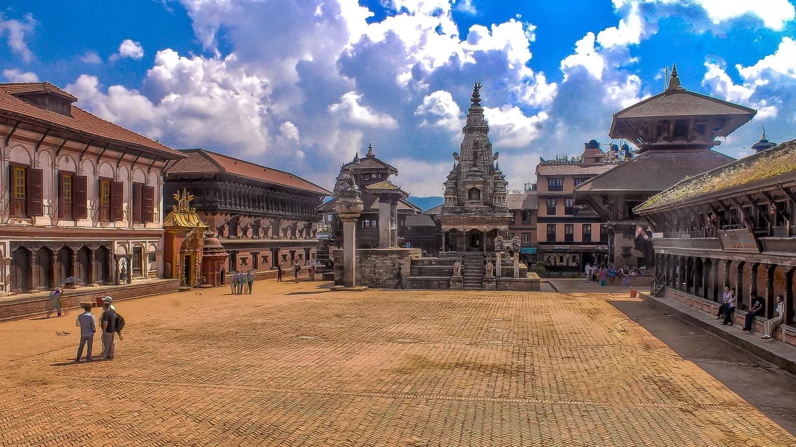 Wide view of Bhaktapur Durbar Square with brick-paved courtyard, pagoda temples and the royal palace complex