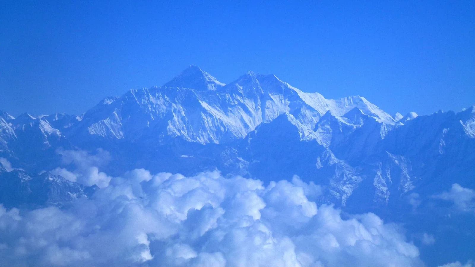 Snow-capped Himalayan peaks seen from the air, the kind of view an Everest mountain flight delivers