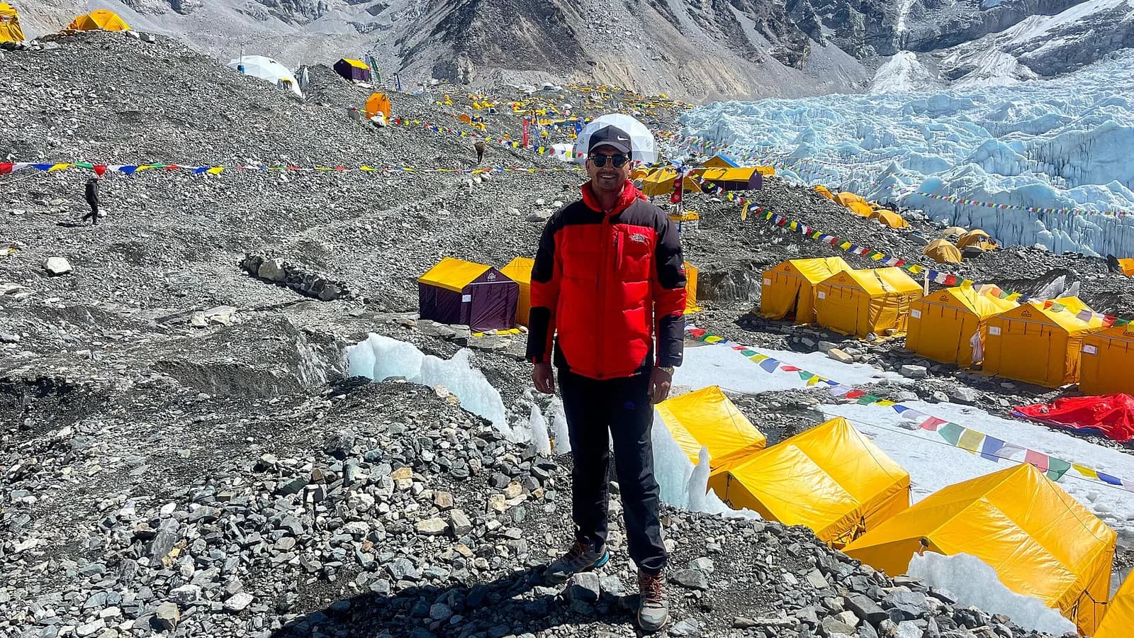 Snow-covered Himalayan peaks viewed from high above, with Mount Everest among the tallest summits along the ridgeline