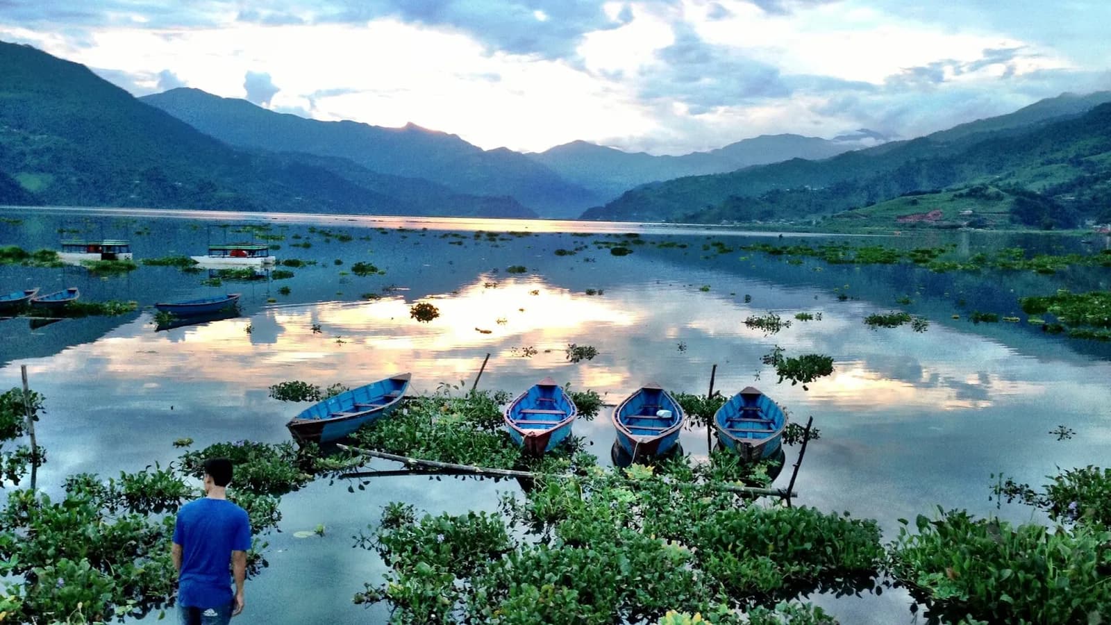 Phewa Lake at Lakeside, Pokhara, with boats on the water and green hills behind