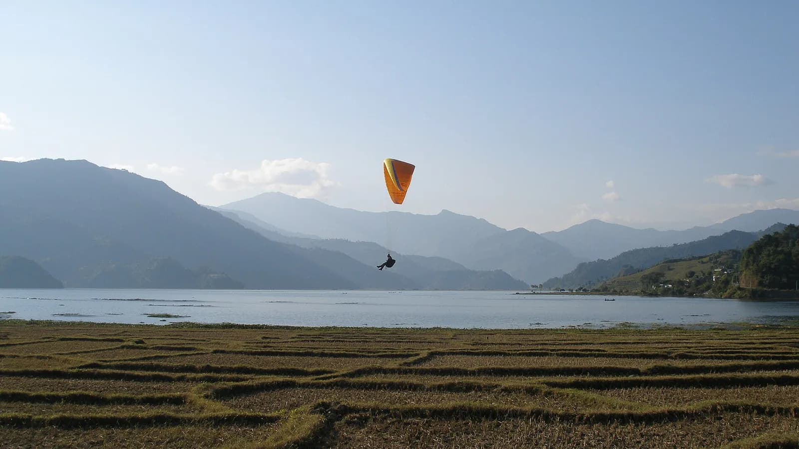 Pokhara town beside Phewa Lake with green hills, the western end of the Kathmandu-Pokhara drive