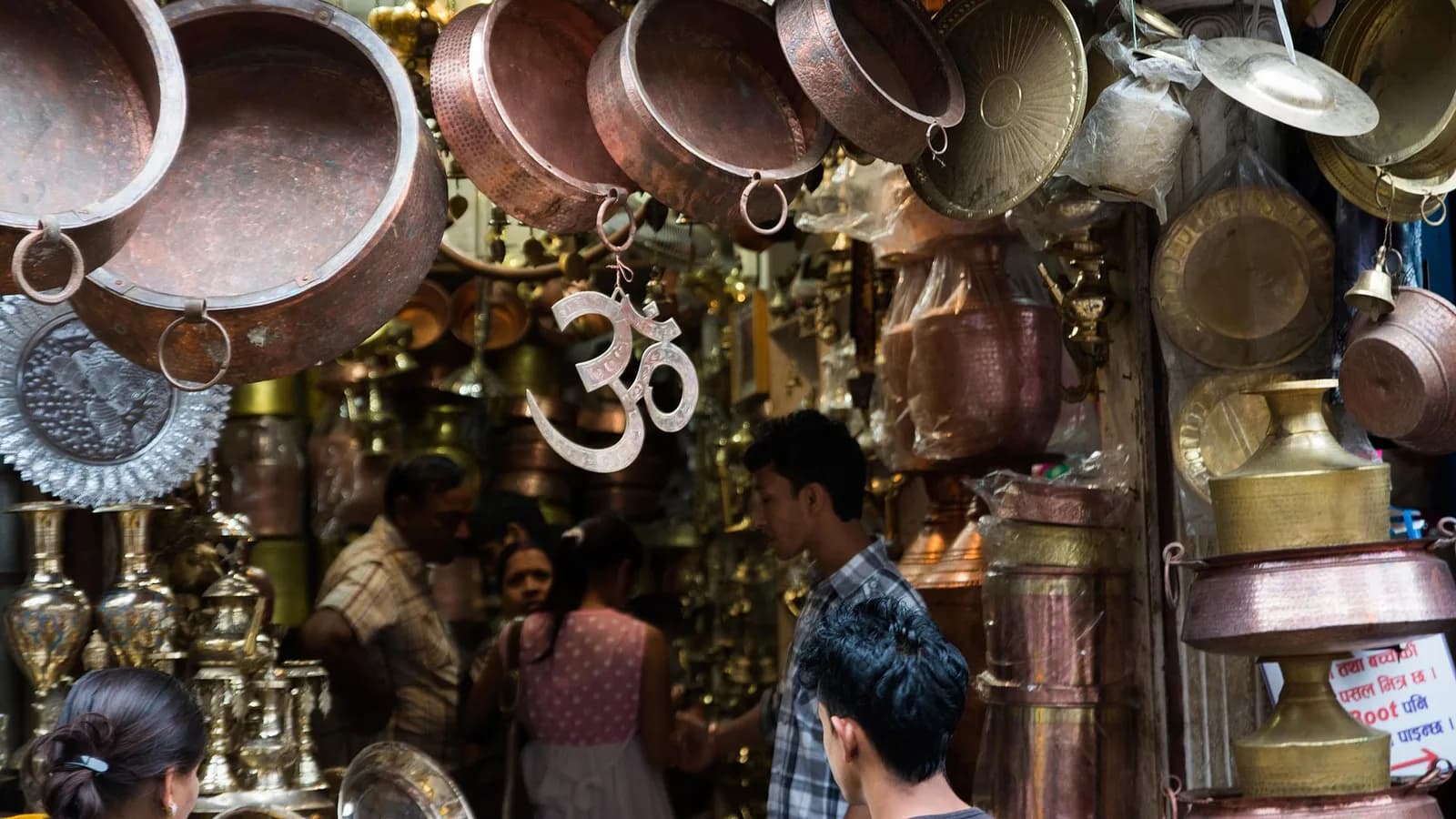 The busy market square of Indra Chowk in old Kathmandu with traditional Newari buildings and shopfronts