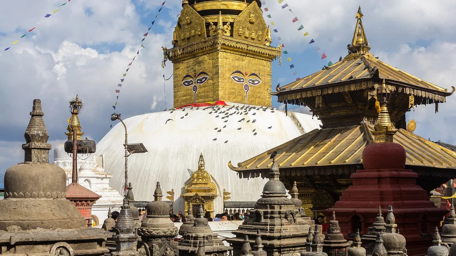 The white dome and gilded spire of Swayambhunath Stupa rising above Kathmandu