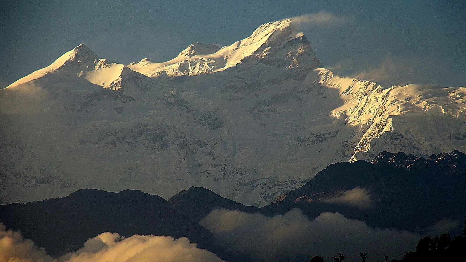 The snow-covered Manaslu massif at sunrise, seen from the Gorkha district foothills