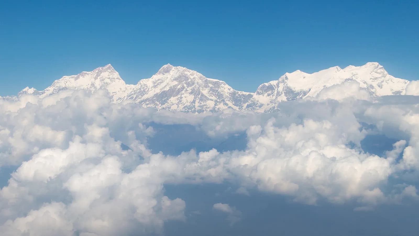 Aerial view of the snow-covered Manaslu Himal massif rising above the Nepalese Himalaya
