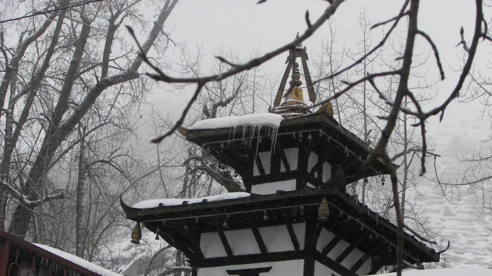 Muktinath temple complex in Mustang with arid Himalayan mountains behind