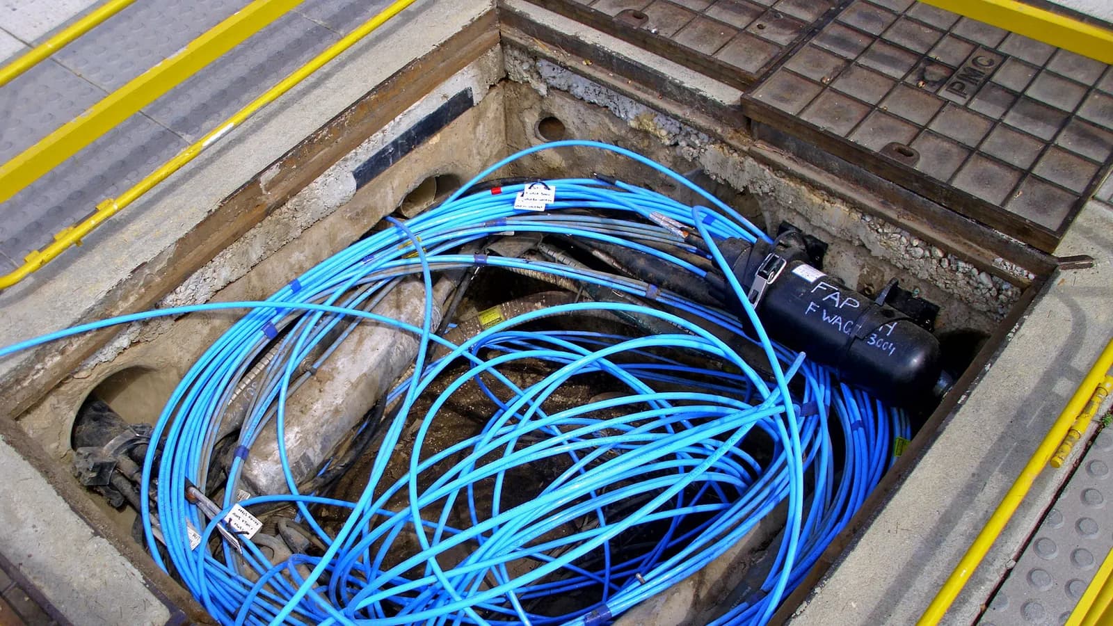 Bundle of fibre-optic cables in a telecommunications pit