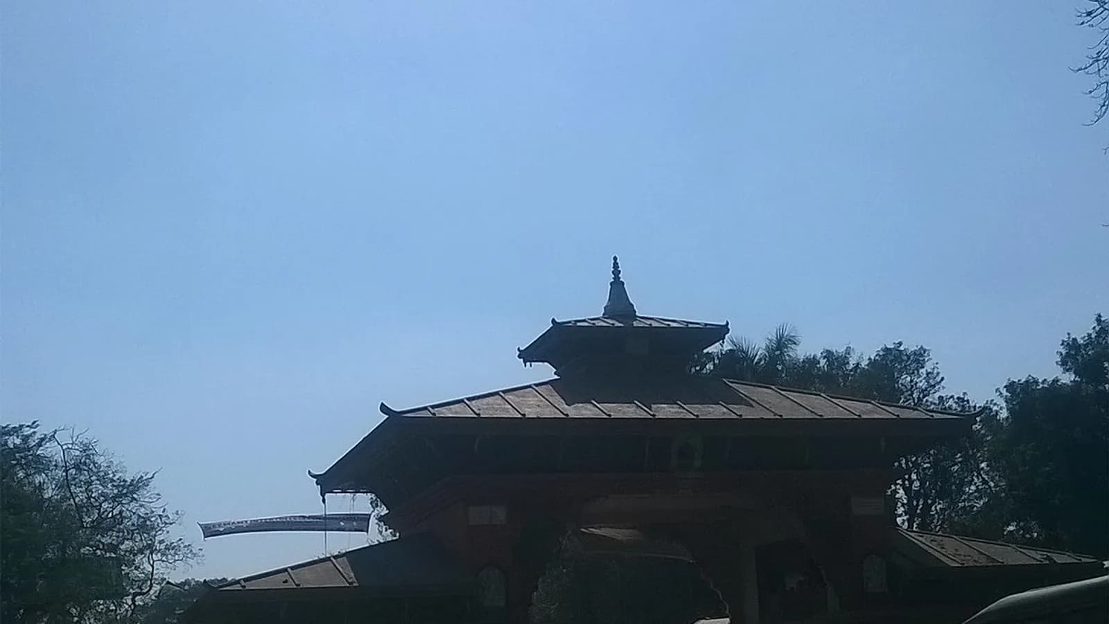 A road border crossing point on the India-Nepal frontier with a welcome gate