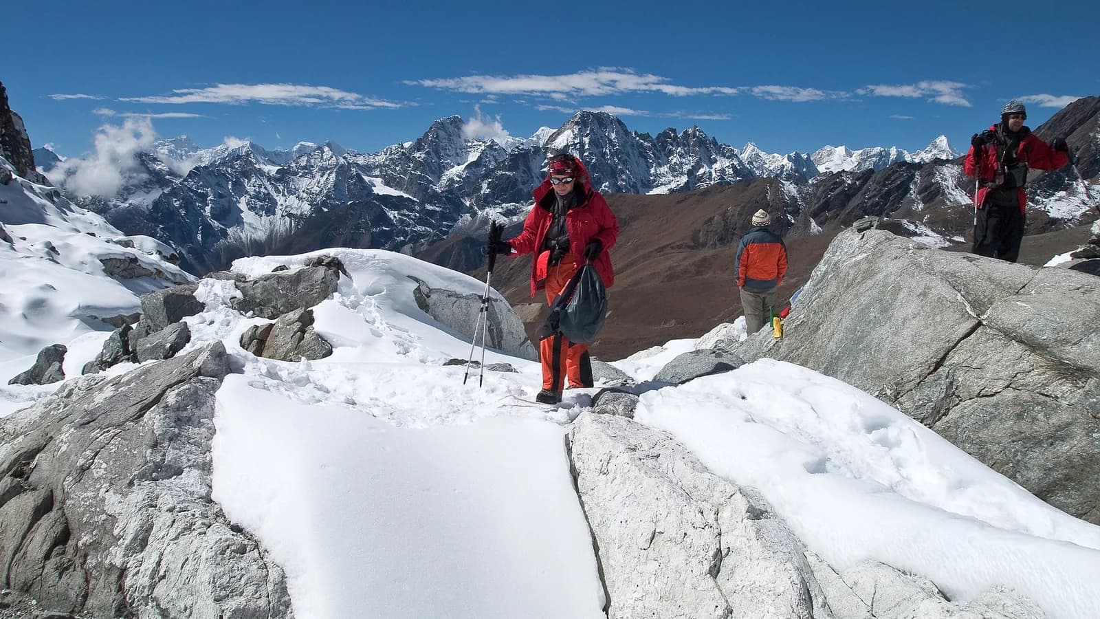 Snow-covered Himalayan peaks under a clear blue autumn sky in Nepal