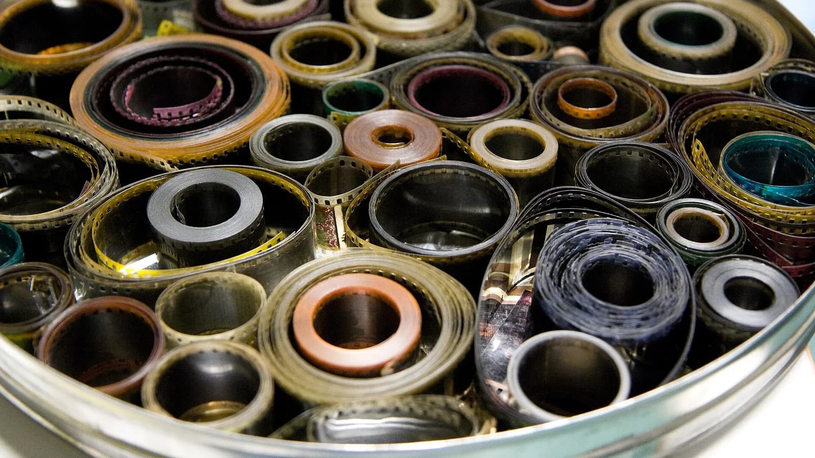 Old celluloid film rolls stacked together