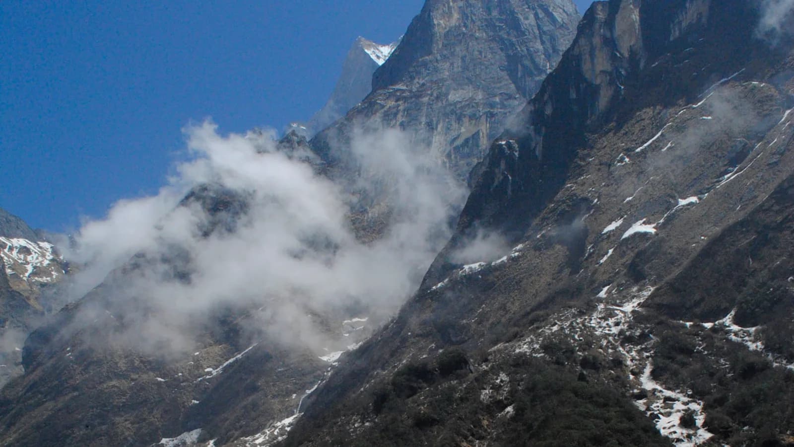 Turquoise Phoksundo Lake ringed by arid Himalayan slopes in Dolpo, Nepal, prime snow leopard country