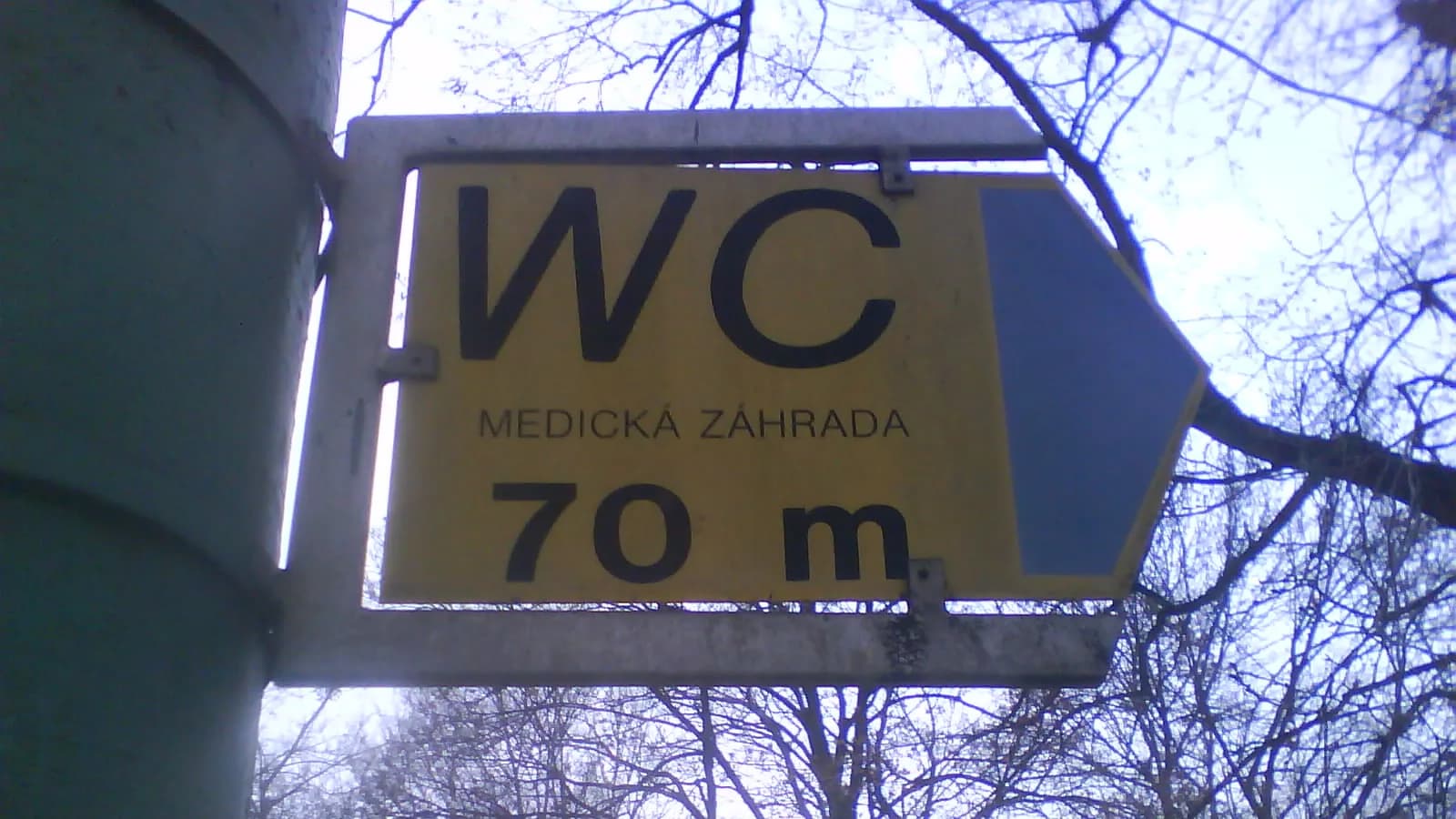 A simple public toilet sign showing male and female figures, the kind seen at facilities for travellers
