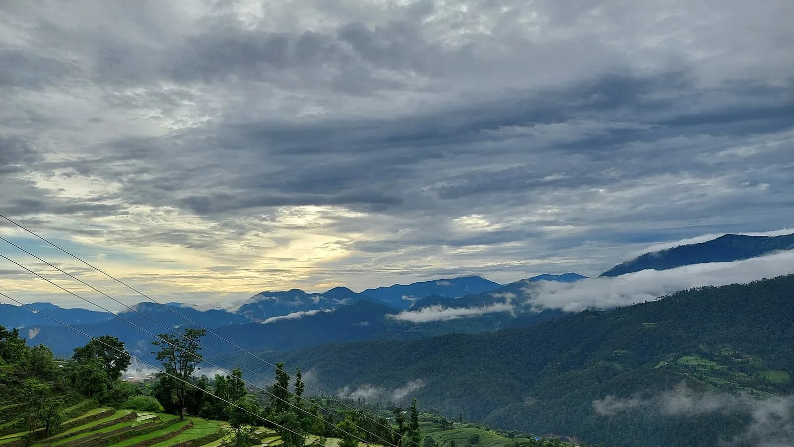 Terraced farmland on the hillsides of rural Nepal, the kind of community where genuine volunteer projects operate