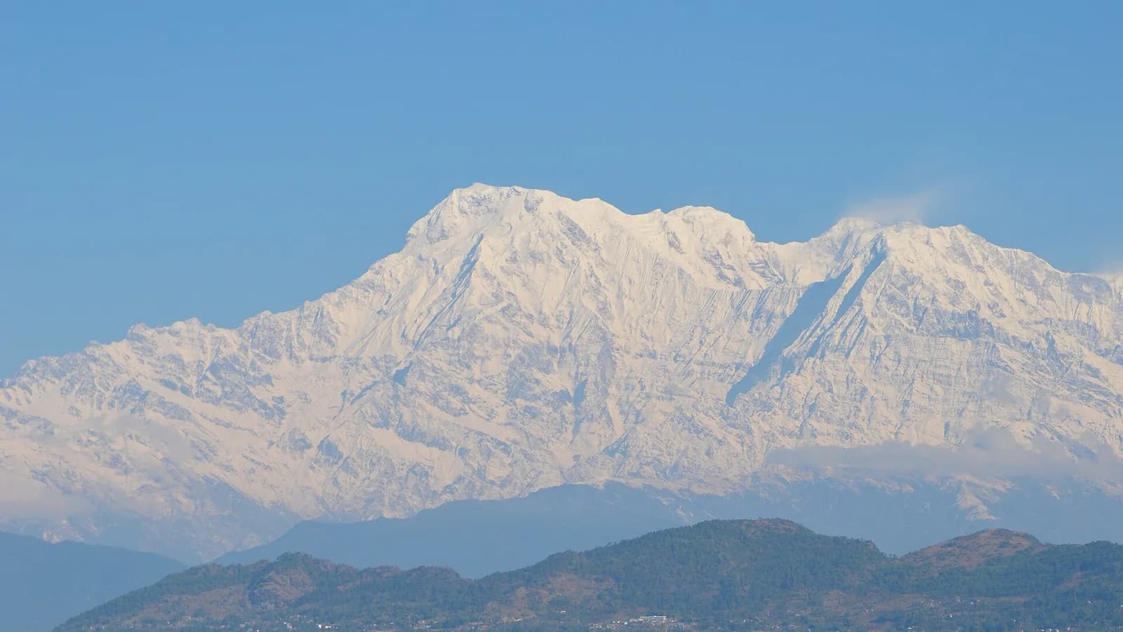 Lakeside district of Pokhara along the shore of Phewa Lake with hills behind